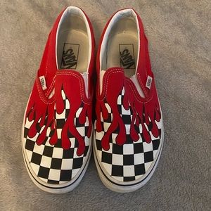 Women’s 8.5 slip on checkered flame vans.